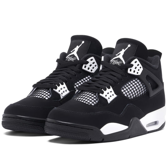 Black sneakers with white accents on a white background