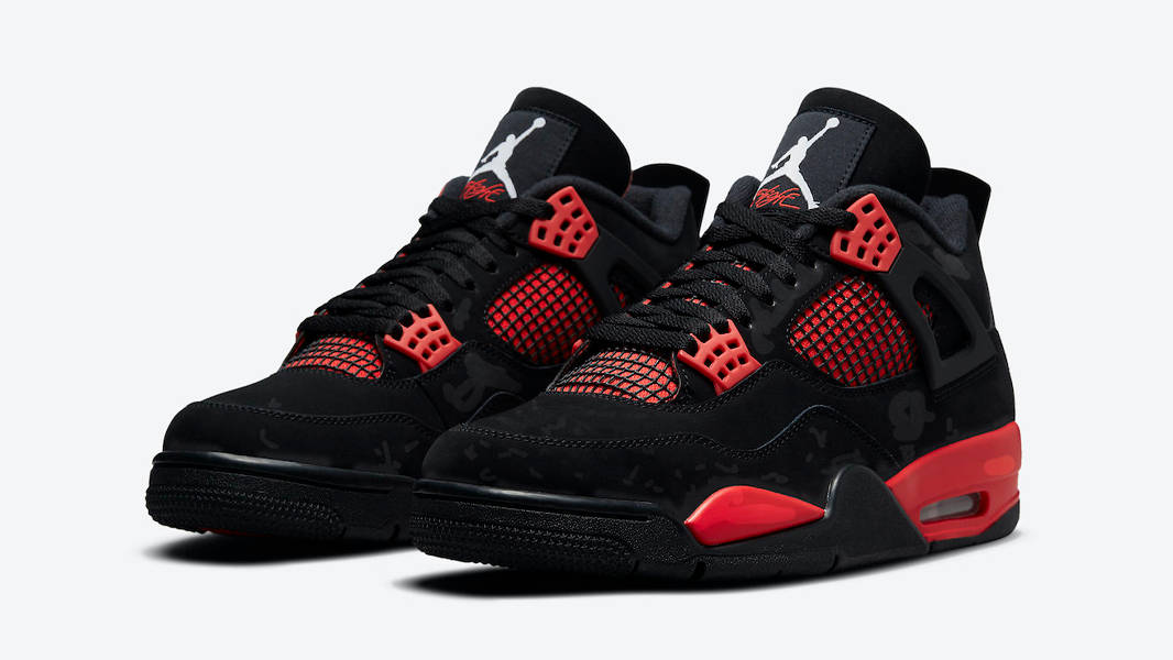 Black and red sneakers with a white background